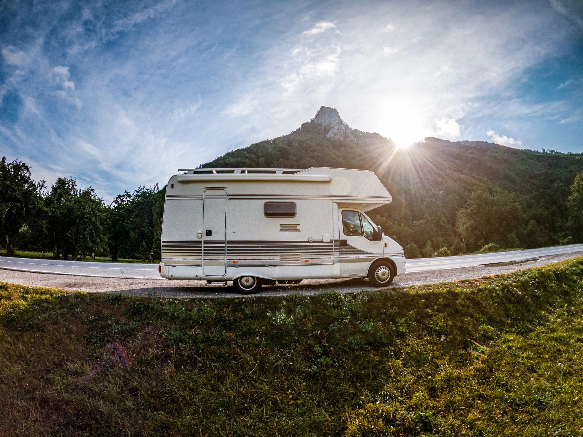 Popup camper parked outdoors in a scenic setting