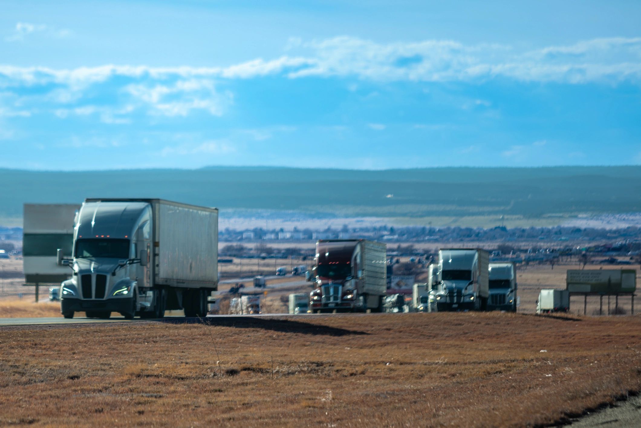 Truck-based travel and road-ready vehicles in an open landscape